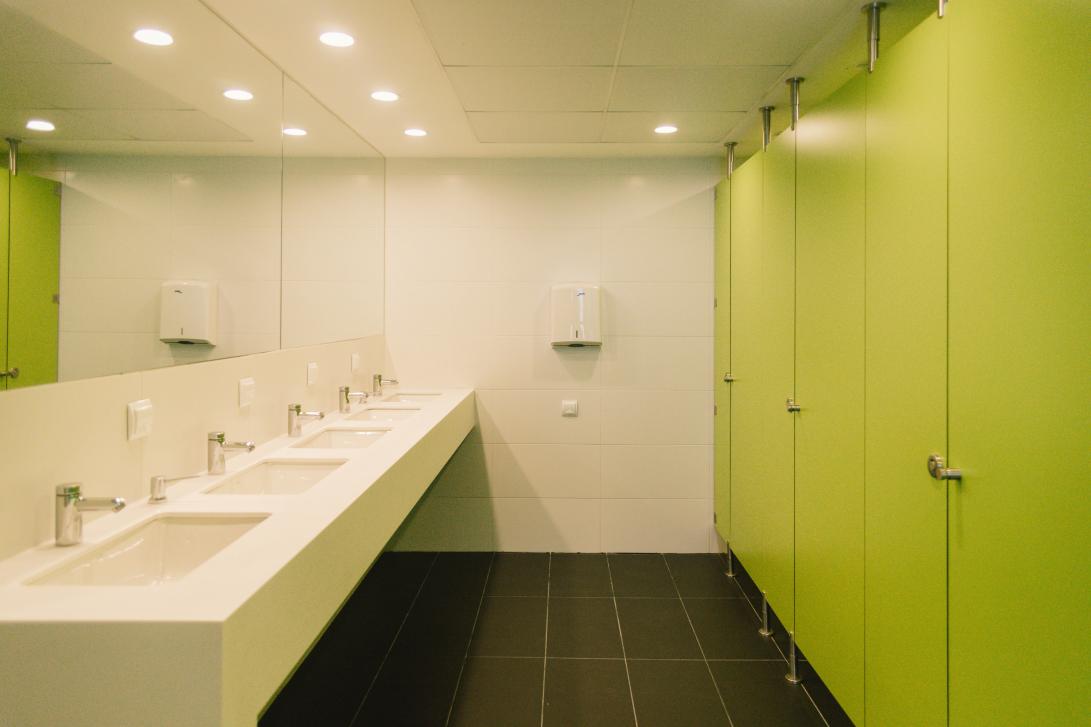 Shared bathroom with shower cabins and individual toilet cubicles, separate from the bedrooms to avoid damp and smells.