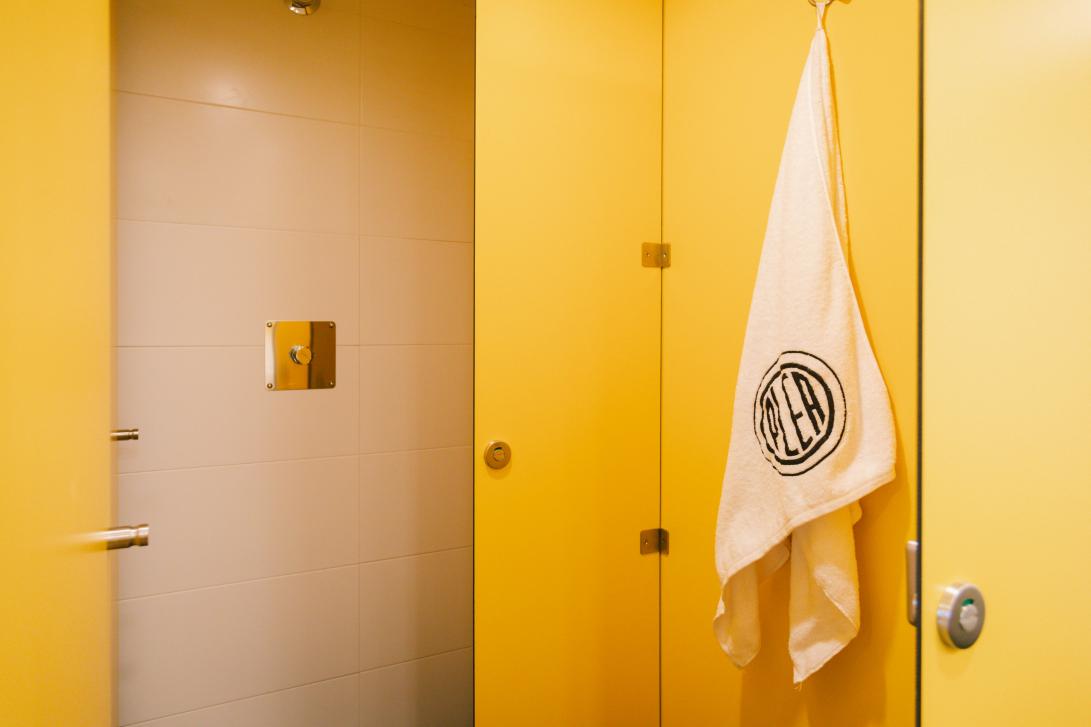 Shared bathroom with shower cabins and individual toilet cubicles, separate from the bedrooms to avoid damp and smells.